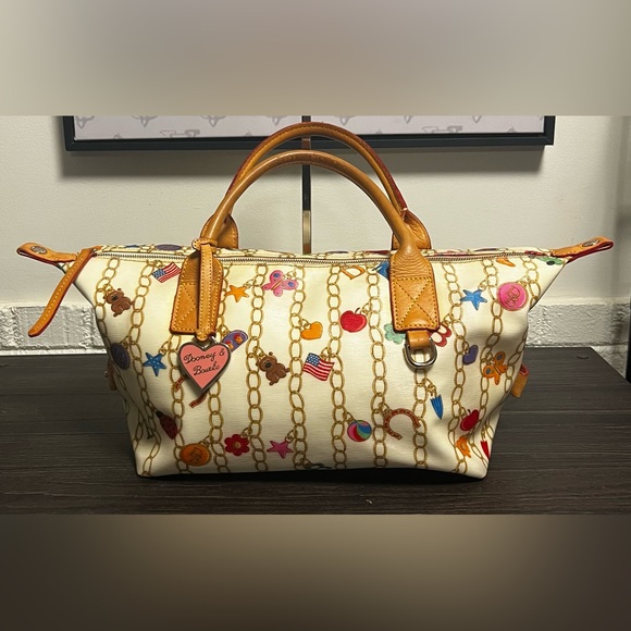 Dooney & Bourke Handbags - Dooney And Bourke "Charms" Vintage Duffle Bag